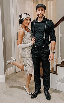 Gala Attire_0003_This may contain_ a man standing next to a woman in a dress